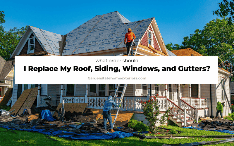 Exterior renovation crew replacing a home’s roof, siding, windows, and gutters in the recommended order.